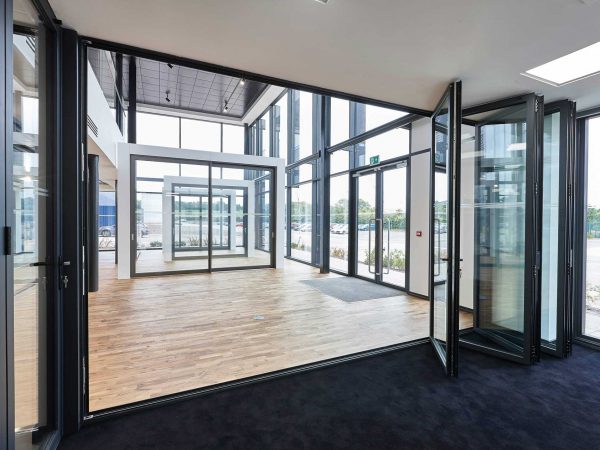 Open space with a lot of black frame windows and doors